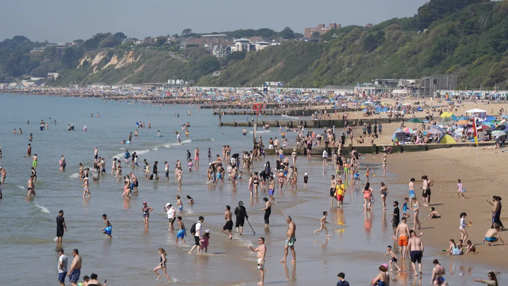 People enjoy the hot weather on Bournemouth beach in Dorset