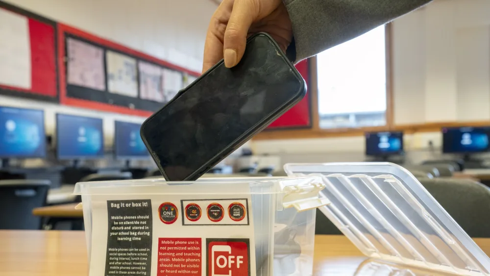 A mobile phone is placed into a timeout basket