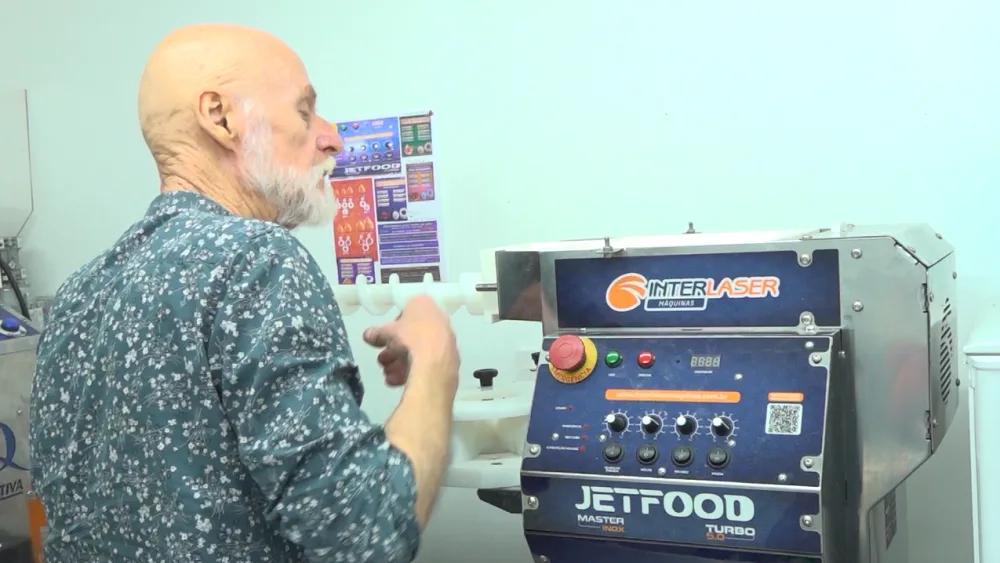 Mr Main using a cooking machine