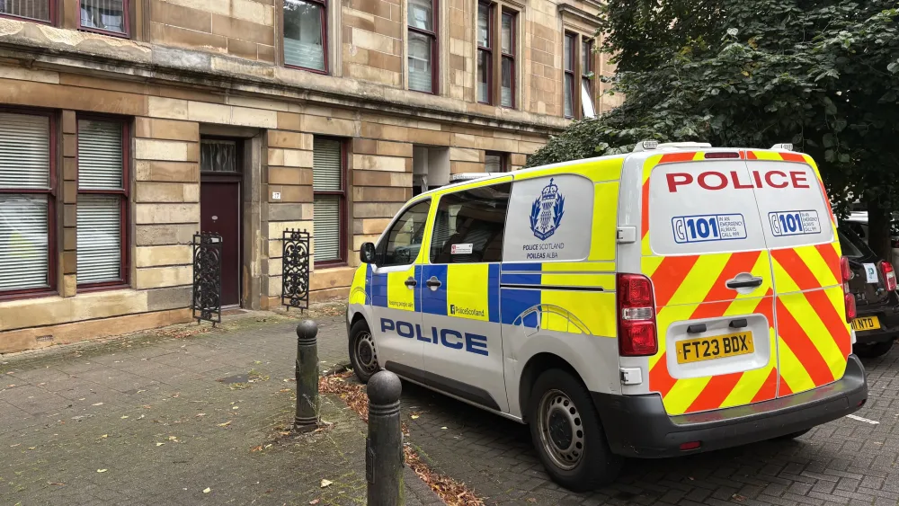 A police van outside flat in Partick