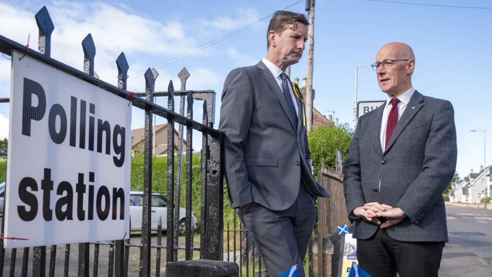 Dave Doogan and John Swinney at a polling station entrance