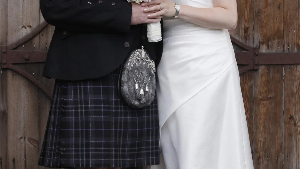 Nicola Sturgeon and Peter Murrell pose for the cameras on their wedding day