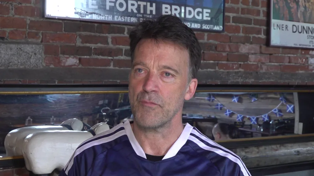 Headshot of Jason Waddleton in a Scotland top