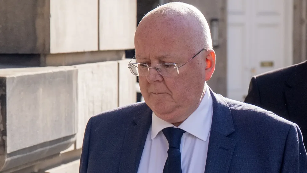 Peter Murrell walking outside court