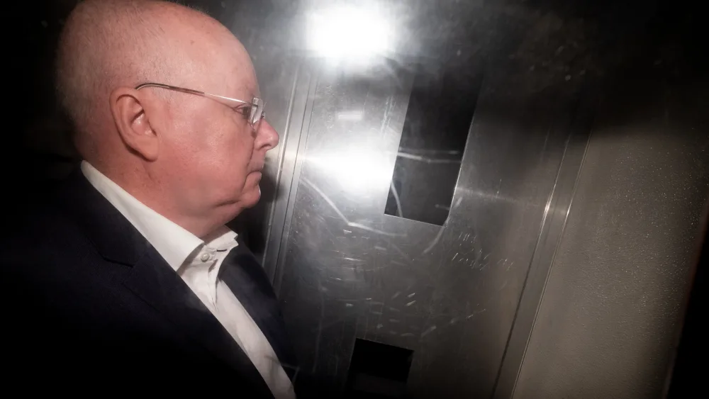 Peter Murrell in the back of a prison van