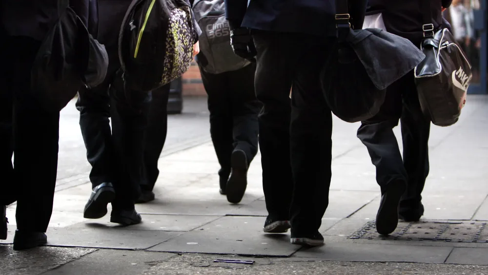 School children's legs viewed from behind