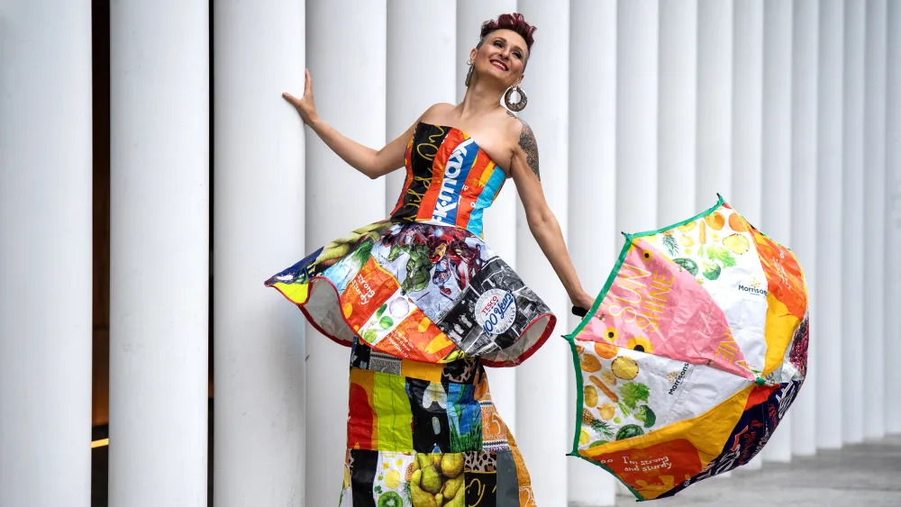 Model wearing dress made from bags for life