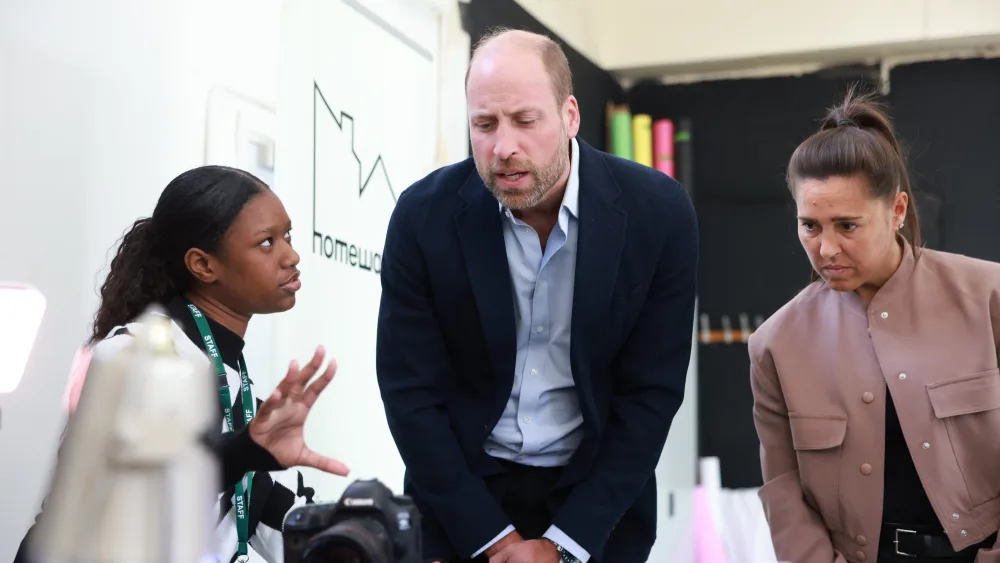 The Prince of Wales meets former England midfielder Fara Williams (right) during a visit to Spiral Skills, in Lambeth, south London, which has received funding from his homelessness initiative