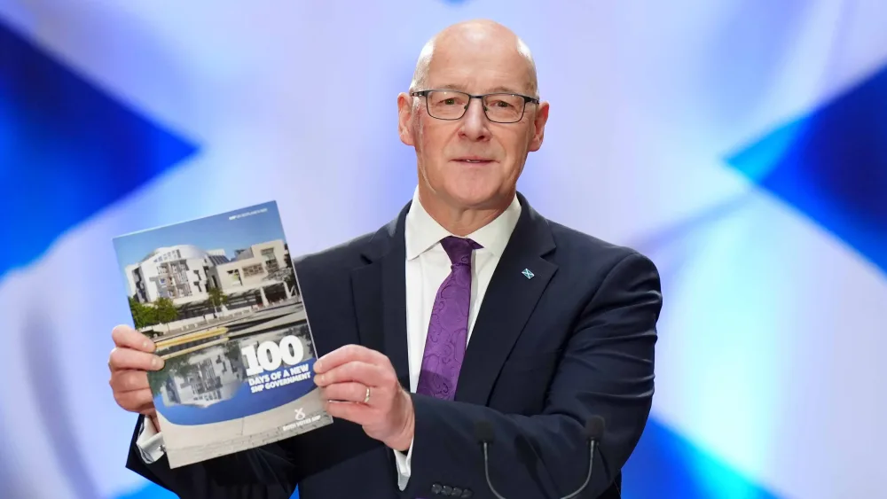 Scottish National Party (SNP) leader John Swinney delivers a speech on the early actions a re-elected SNP Government would take to support people