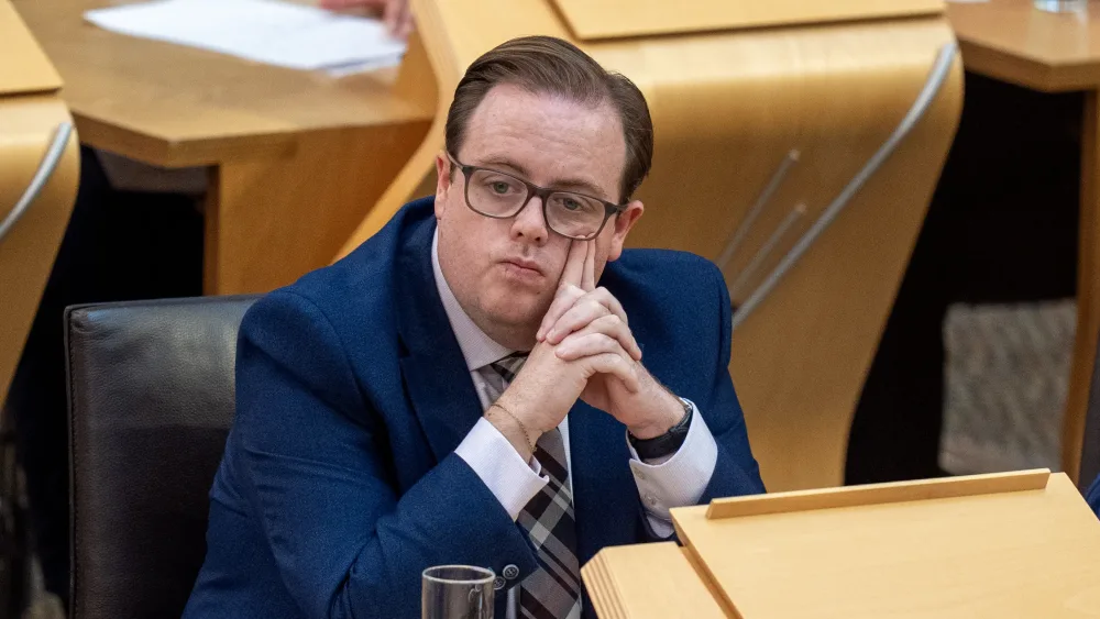 Thomas Kerr seated in Holyrood