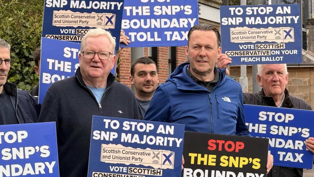 Russell Findlay, centre right, and Jackson Carlaw, centre left, holding placards with Scottish Tory campaigners