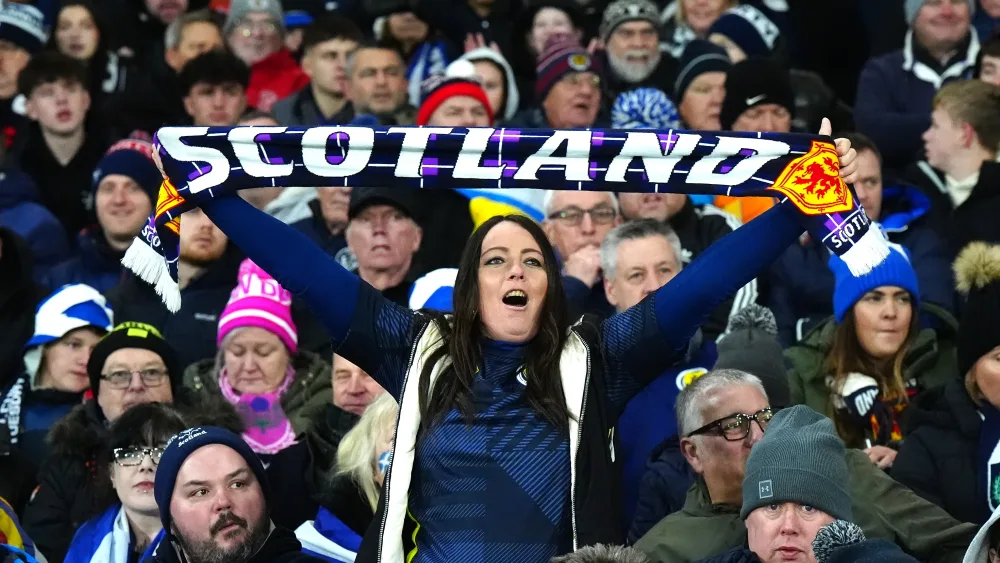 A Scotland fan with a scarf