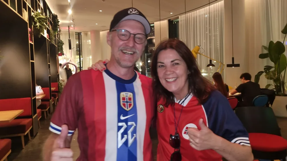 Torfin and Alison Nesvo smiling and giving the thumbs up