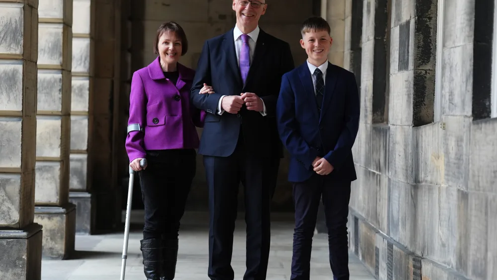 Elizabeth Quigley, John Swinney and their son Matthew smiling