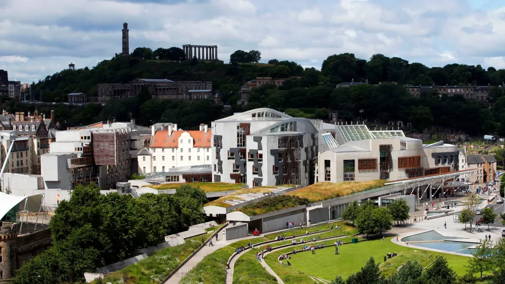 A view of the Holyrood building, with Carlton Hill beyond