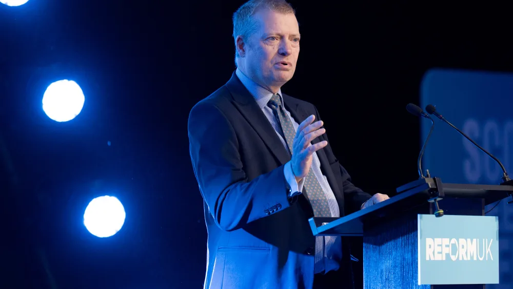 Graham Simpson speaking from a Reform UK lectern
