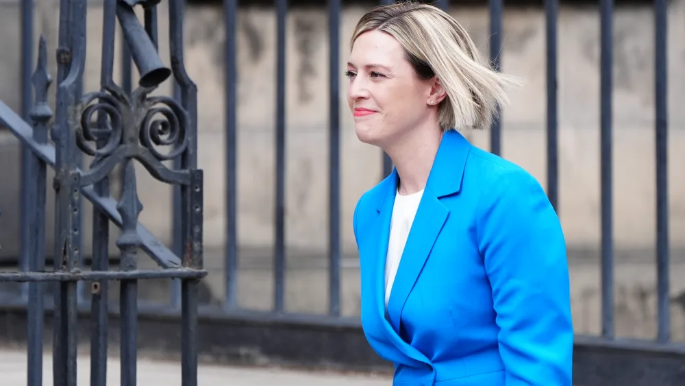Side view of Jenny Gilruth smiling while walking outside