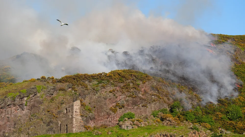 Smoke rising from a fire close to the ruins of St Anthony’s Chapel in Holyrood Park