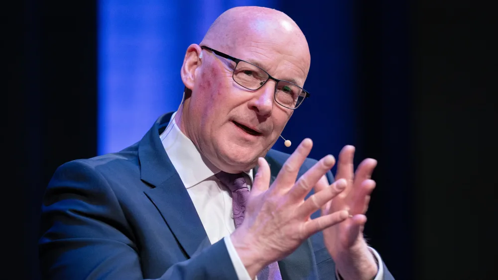 John Swinney with his hands steepled