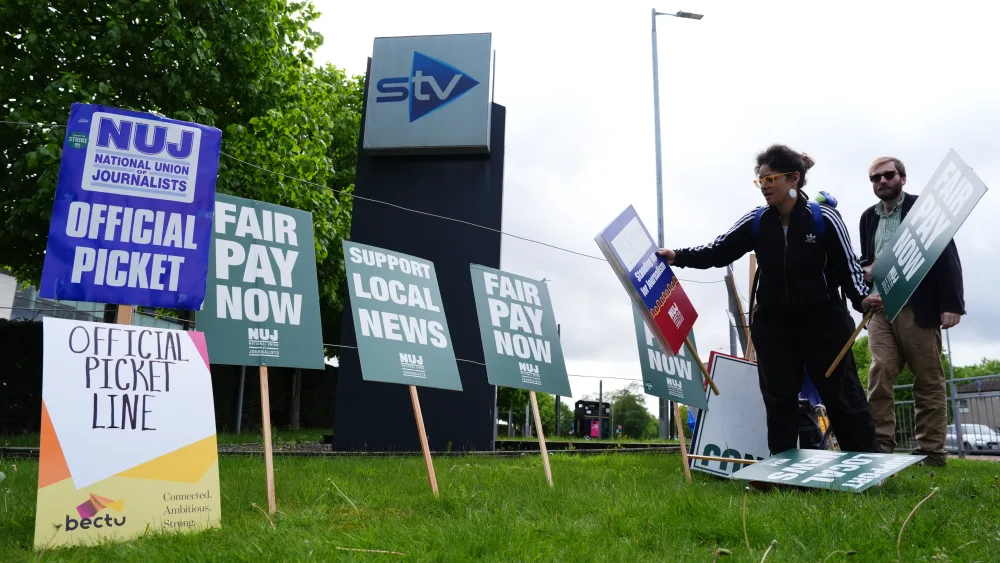 STV staff and placards on a picket line