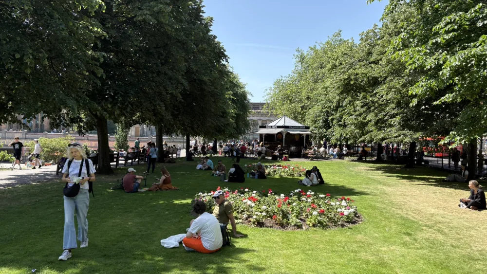 People sitting on the grass in Prince Street Gardens