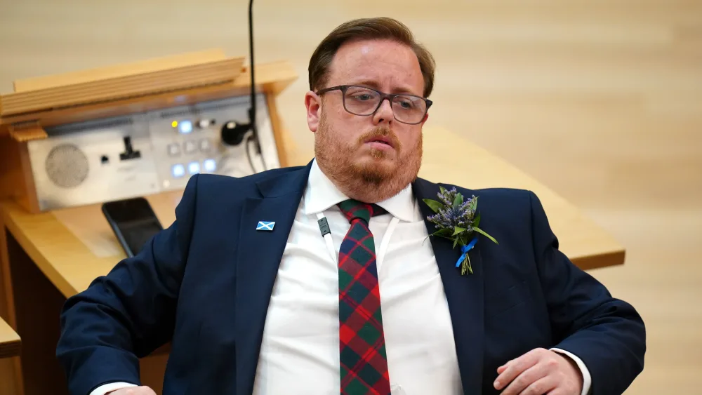 Thomas Kerr seated in Holyrood