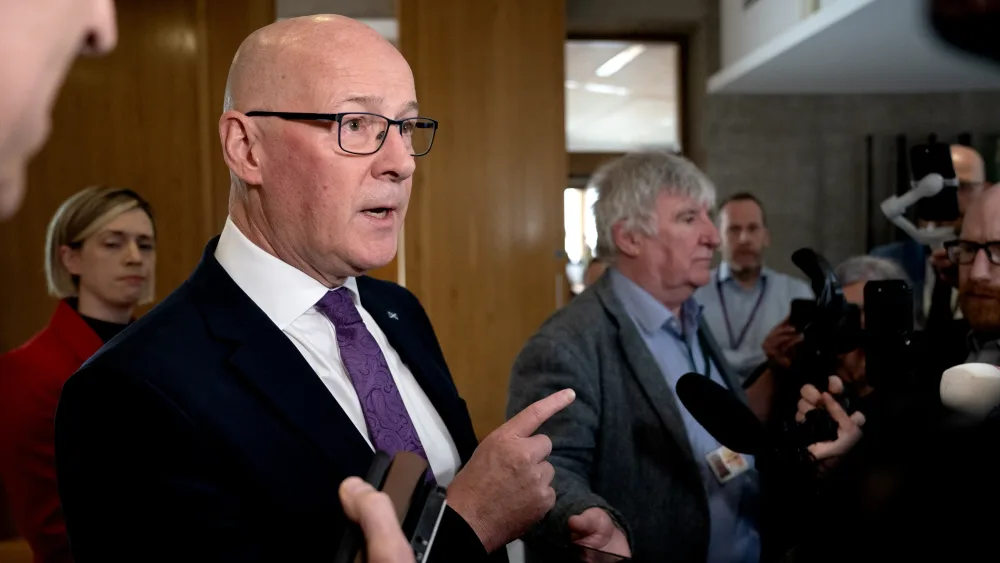 John Swinney speaks to journalists