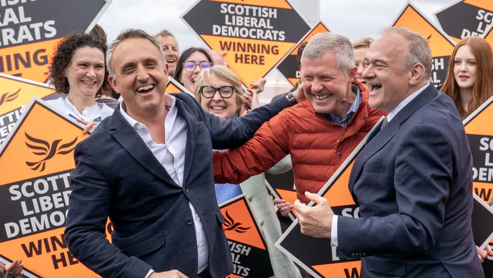 Scottish Liberal Democrat leader Alex Cole-Hamilton (left) with former leader Willie Rennie (centre) and Liberal Democrat leader Sir Ed Davey (right) alongside newly elected MSPs at Newhaven Lighthouse, Edinburgh