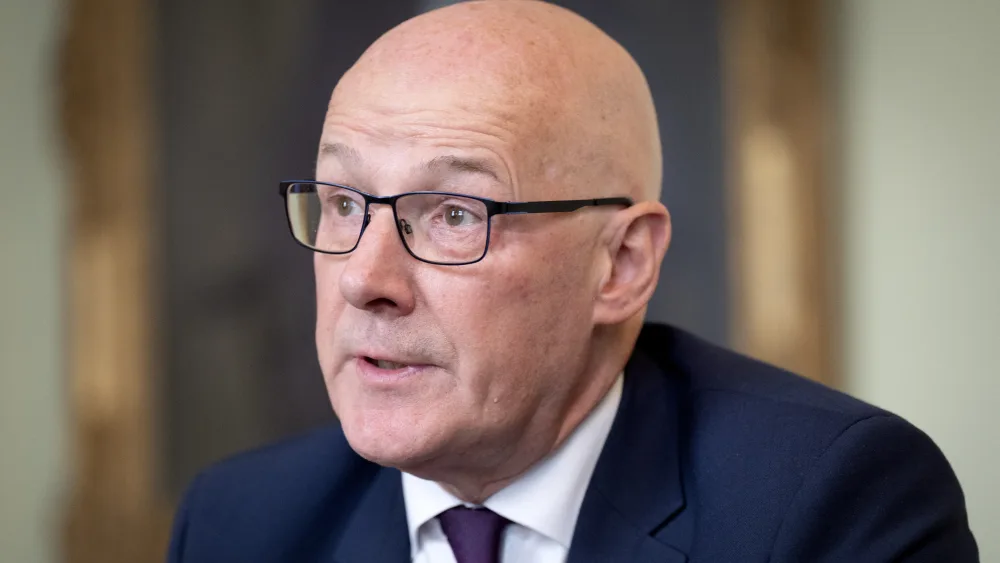 Headshot of John Swinney speaking