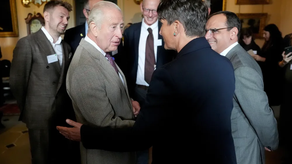 The King chatting amongst a group of people