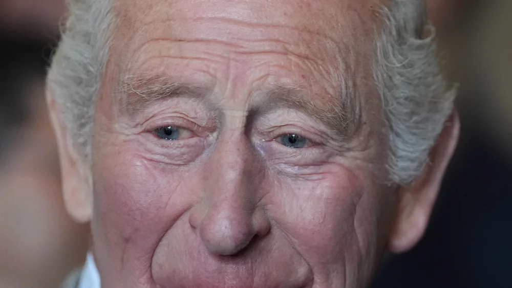 Headshot of the King smiling while speaking
