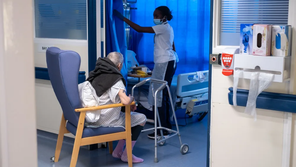 A patient and hospital working on a hospital ward
