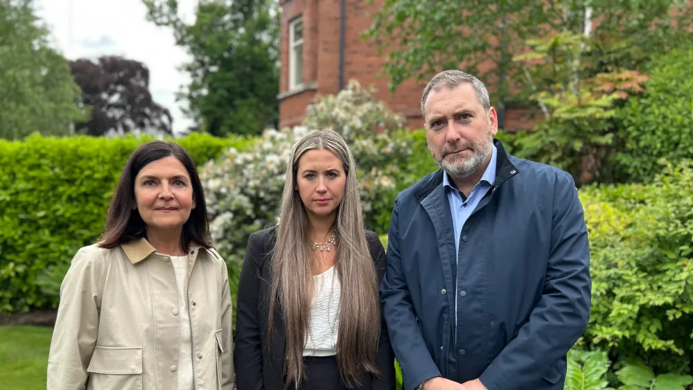 Alliance MP Sorcha Eastwood with Des and Patricia Conroy (Claudia Savage/PA)