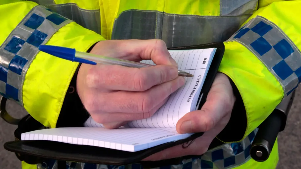 A police officer with a notebook