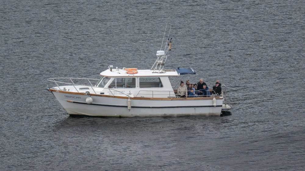 A small white boat on water