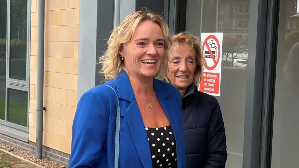 Sandie Peggie smiling outside the tribunal