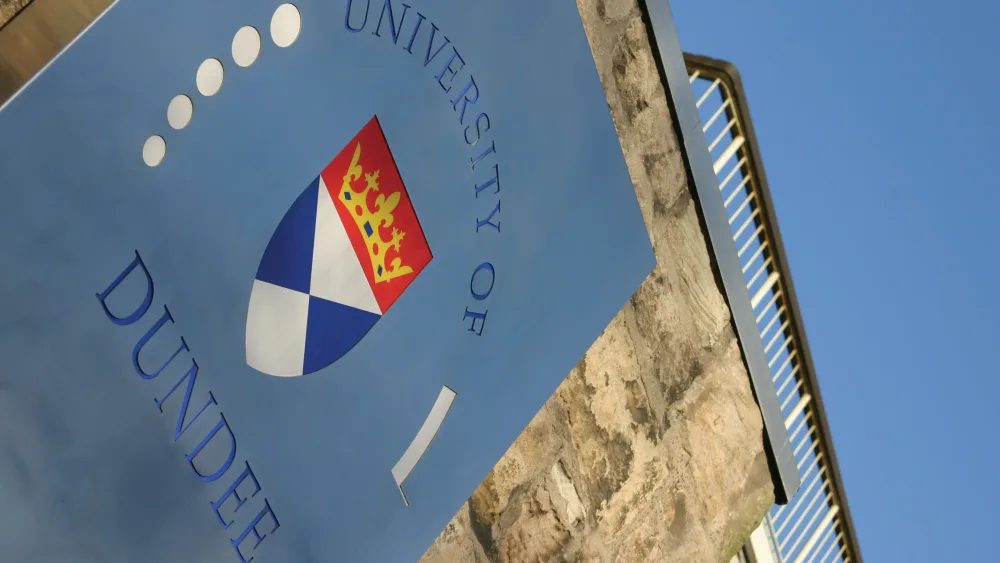 University of Dundee sign on a wall