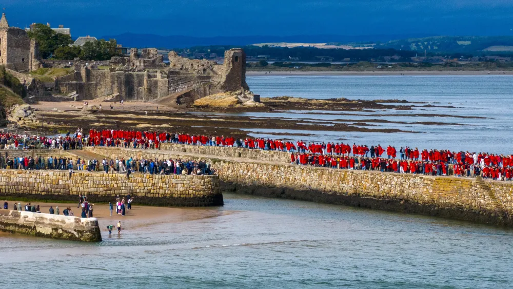 Students walking along pier