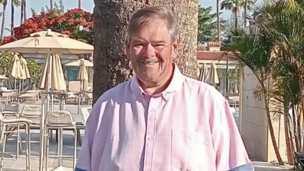 Stephen Allan poses for a photograph while on holiday