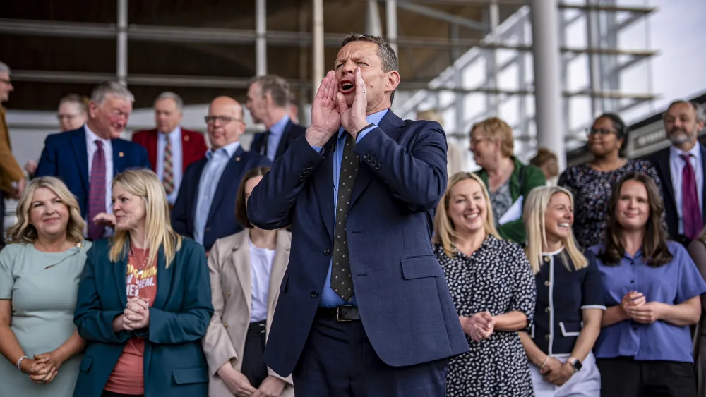 Plaid Cymru leader Rhun ap Iorwerth speaks to supporters on the steps of the Senedd 