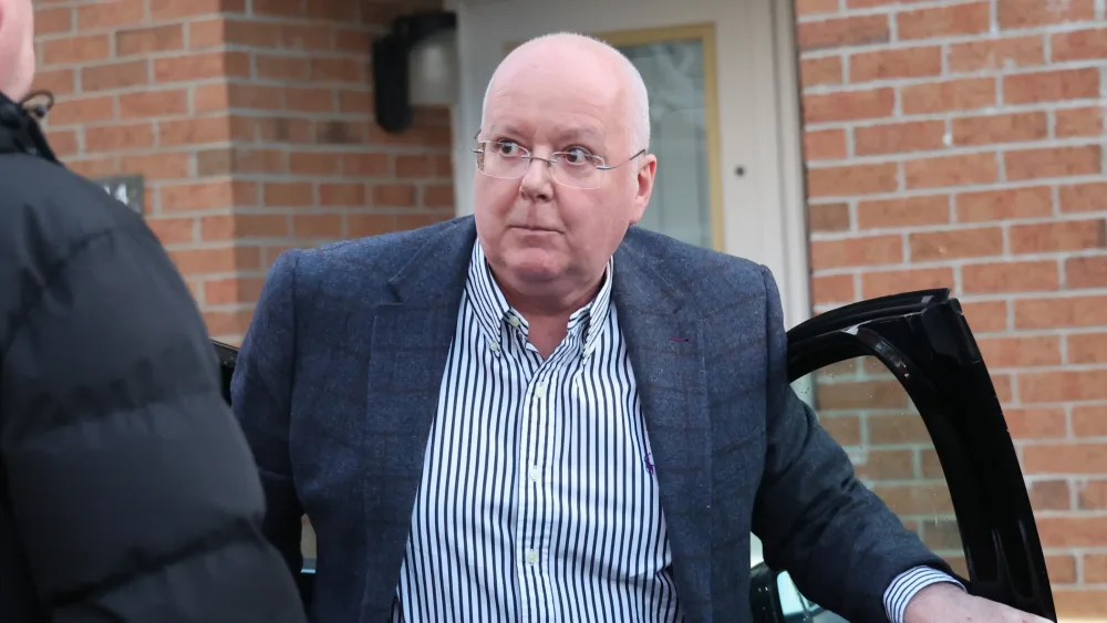 Peter Murrell gets out of a car